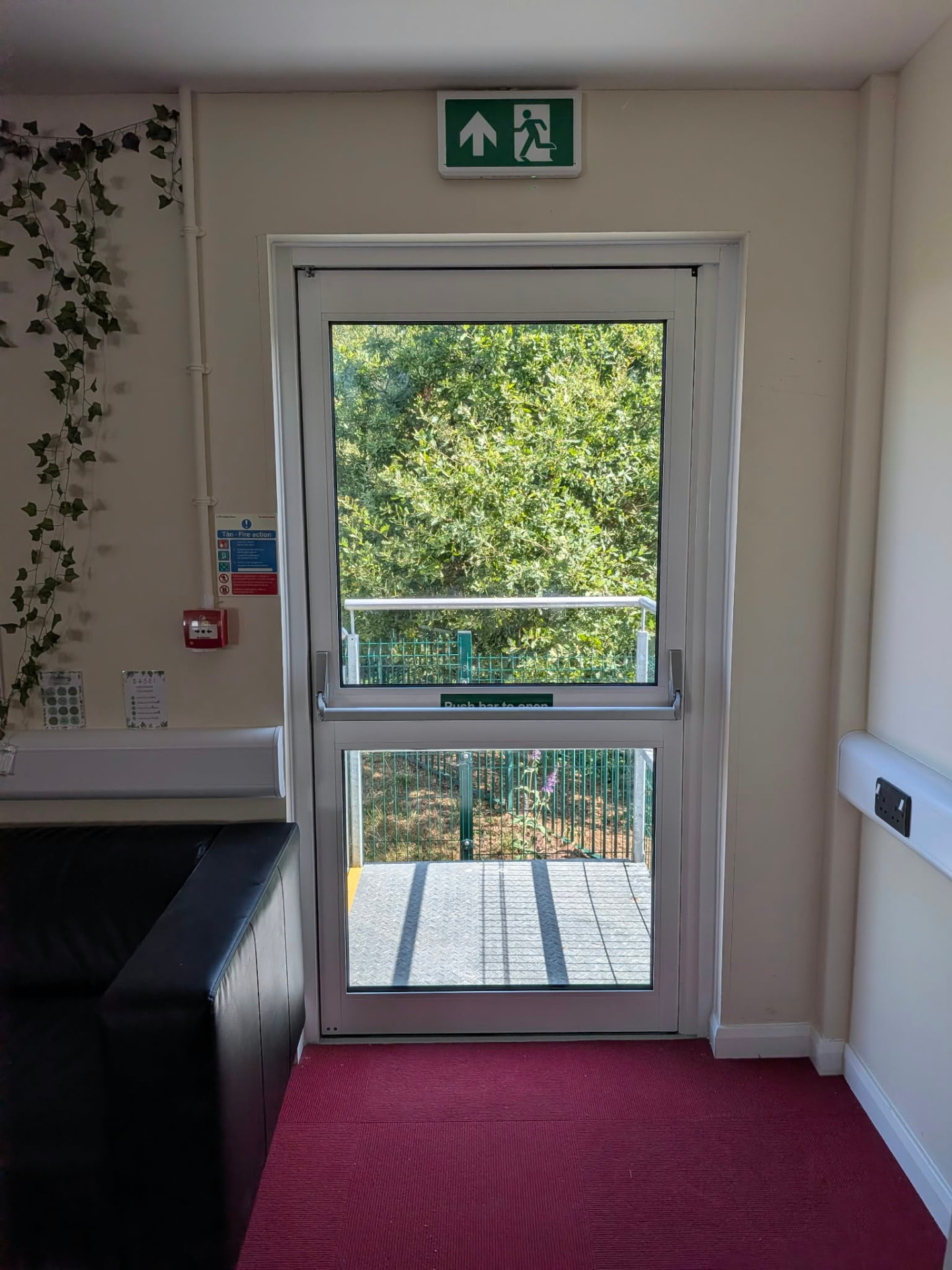 Aluminium fire exit door with push bar by Essential Glazing Products