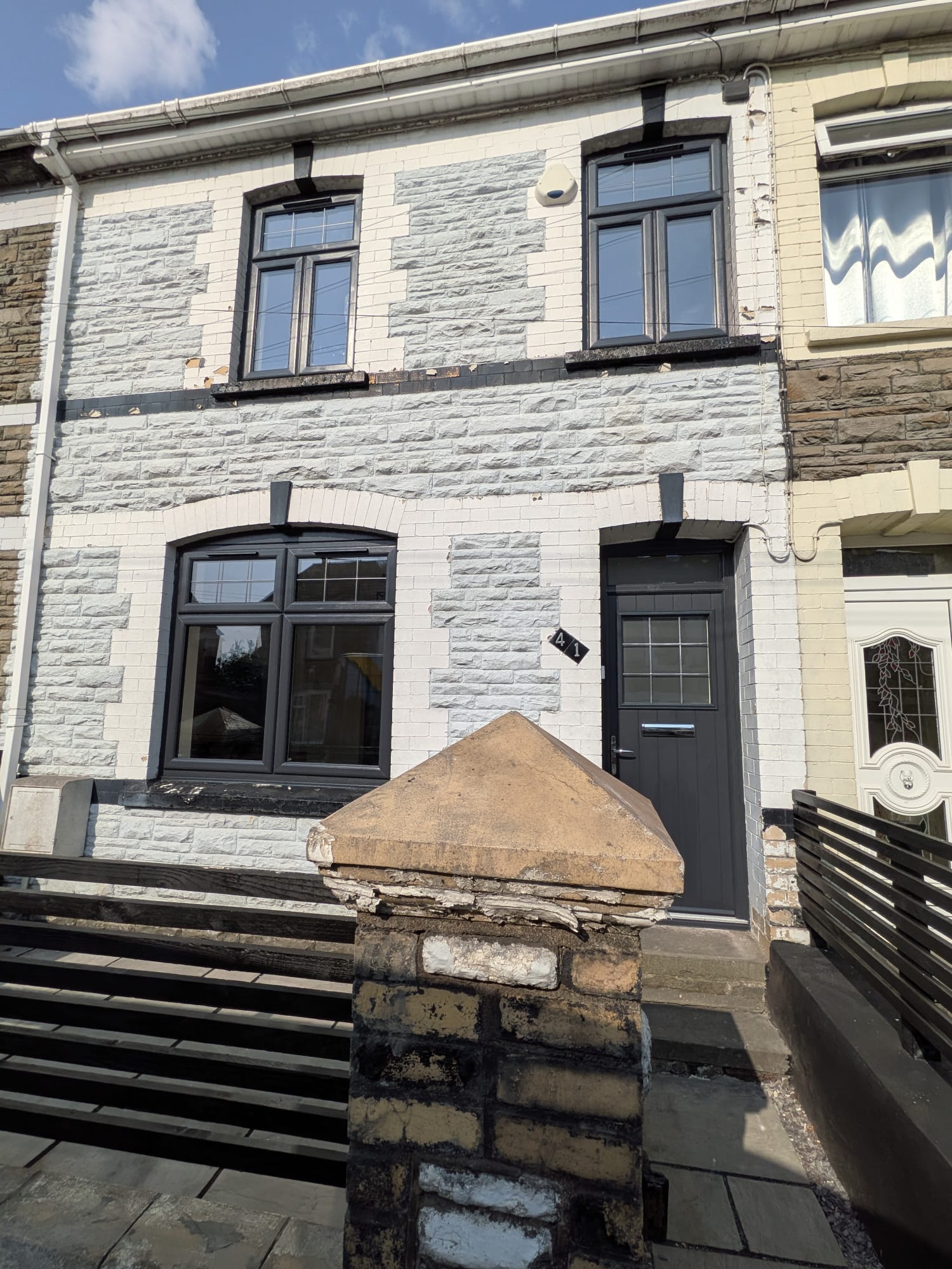 Anthracite grey uPVC windows on a terraced house by Essential Glazing Products