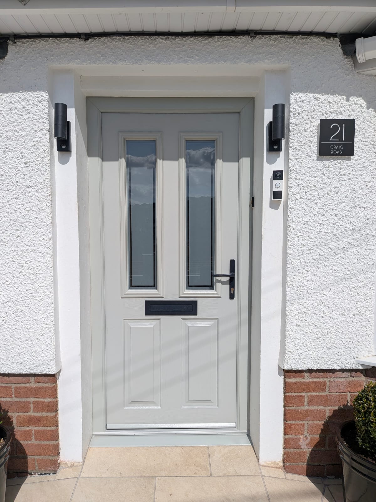 Light grey composite front door by Essential Glazing Products