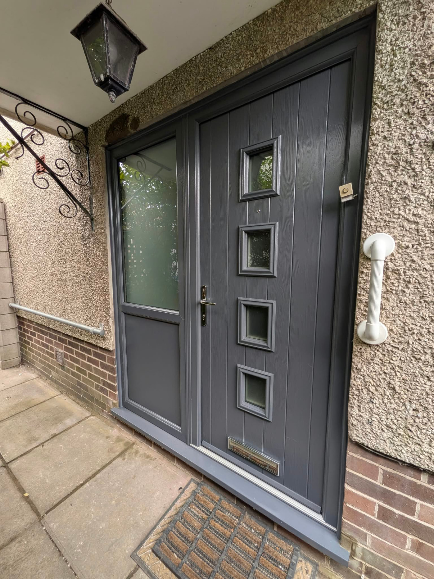 Grey composite door with side panel by Essential Glazing Products